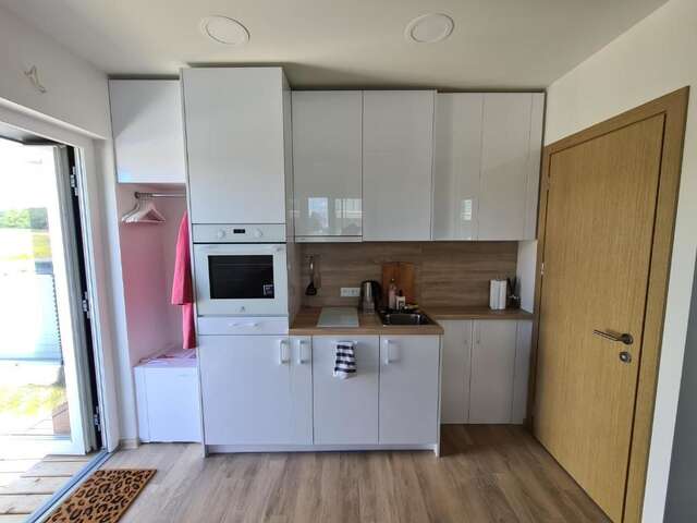 Апартаменты Vaivorykštės 7D apartamentai (su baseinu) Паланга-26